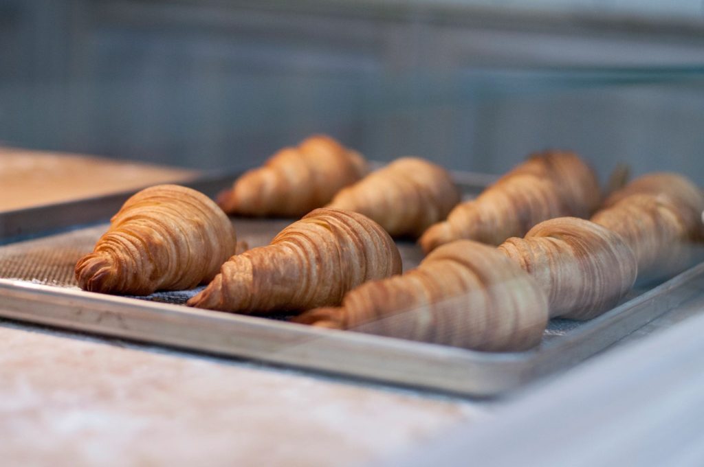 a tray of baked croissants