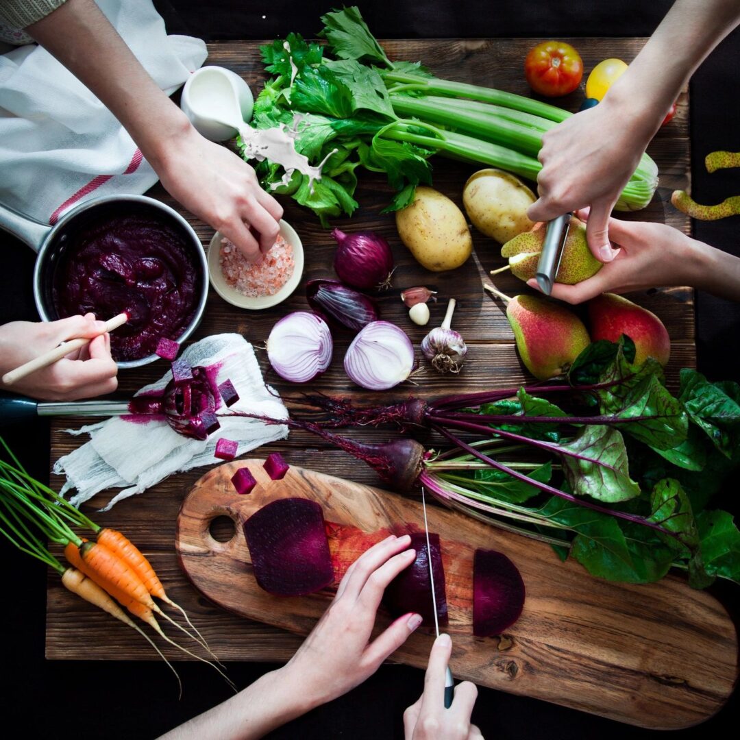 a group of people preparing ingredients